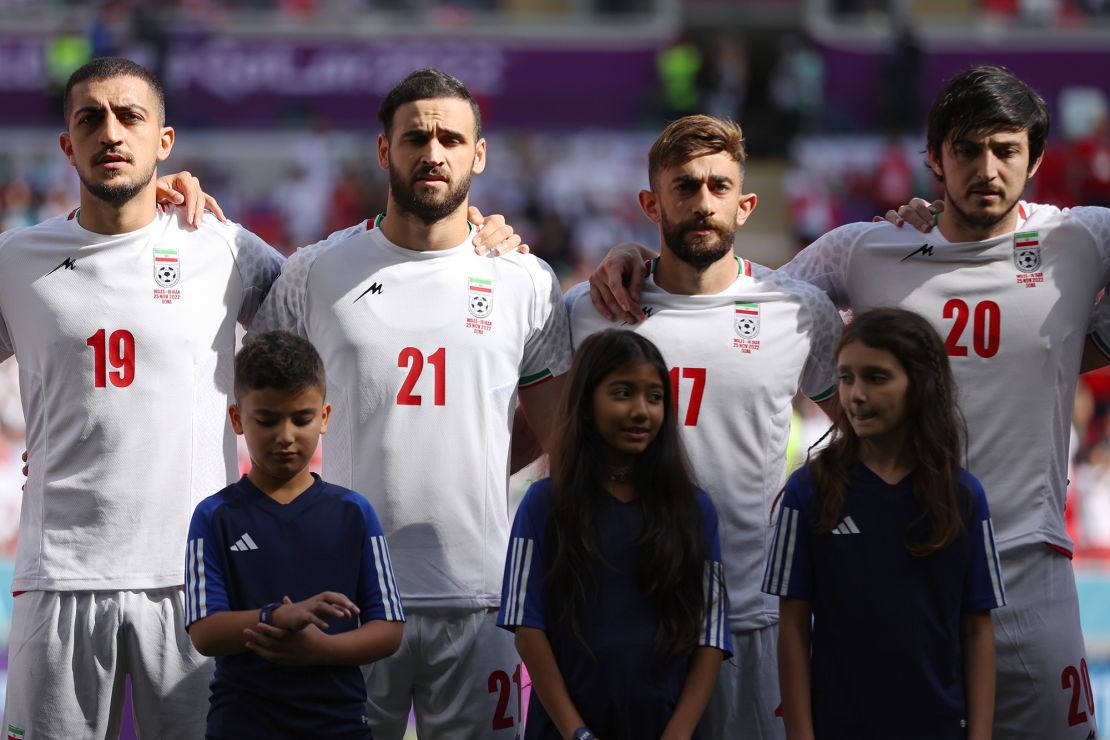 Iran players line up for the national anthem prior to the match against Wales.