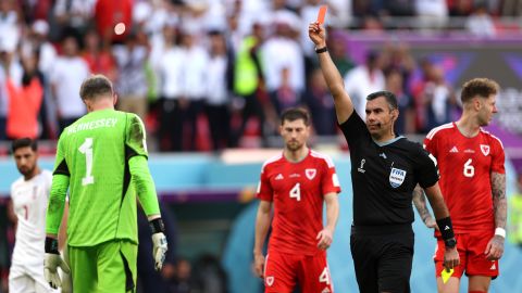 Hennessey is shown the red card -- the first of Qatar 2022.