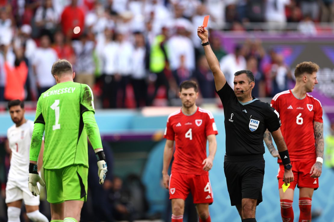 Hennessey is shown the red card -- the first of Qatar 2022.