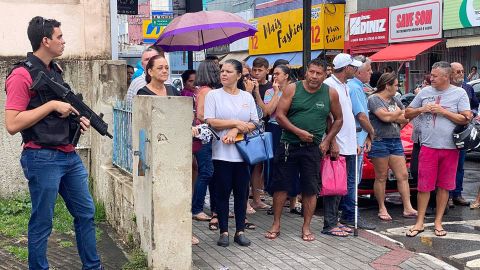 Local residents gathered in front of the Aracrus police station where the perpetrators of the two school shootings are being held.