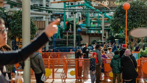 Families enjoy the Nickelodeon Universe theme park inside the mall.