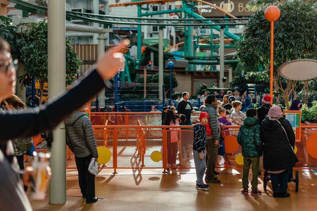 Families enjoy the Nickelodeon Universe theme park inside the mall.