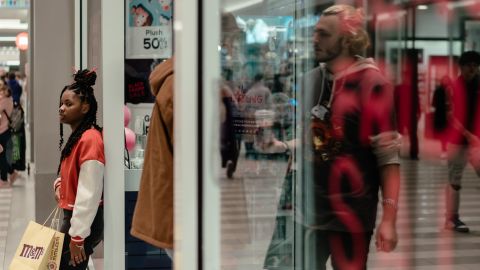 Shoppers walk through the mall during the day.