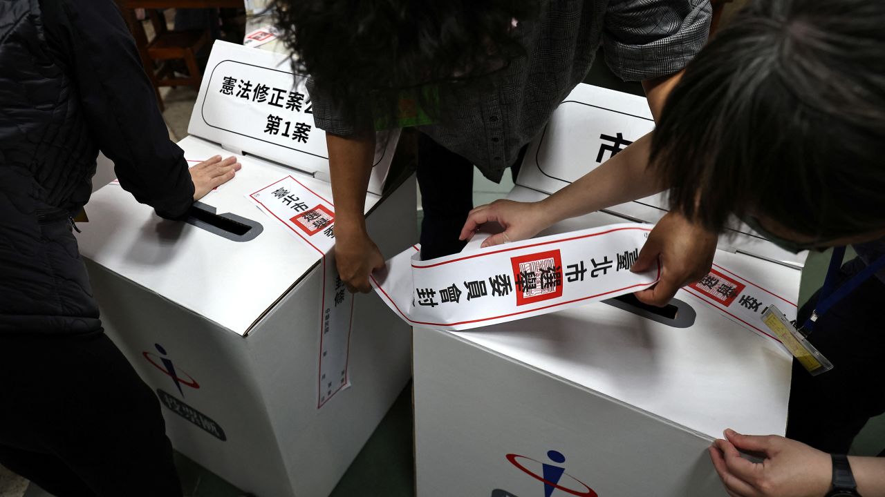 Staff prepare the ballot box ahead of election day in Taipei, Taiwan, November 26, 2022. 