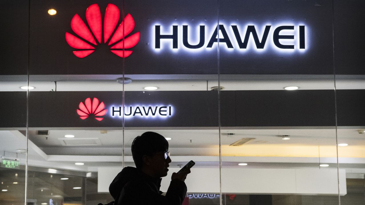 BEIJING, CHINA - JANUARY 29: A pedestrian talks on the phone while walking past a Huawei Technologies Co. store on January 29, 2019 in Beijing, China. The U.S. Justice Department filed a host of criminal charges against Chinese telecoms giant Huawei and its chief financial officer, Meng Wanzhou, including bank fraud, violating sanctions on Iran, and stealing robotic technology. Huawei denied committing any of the violations and rejected criminal claims against Meng, the daughter of Huawei founder Ren Zhengfei, who was arrested in Canada in December last year. (Photo by Kevin Frayer/Getty Images)