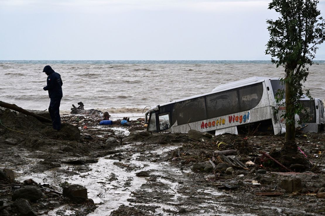 Vehicles damaged by the landslide are pictured on Saturday.