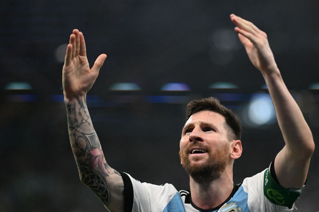 Argentina's Lionel Messi celebrates scoring the opening goal against Mexico on Saturday. Argentina went on to win the critical match 2-0.