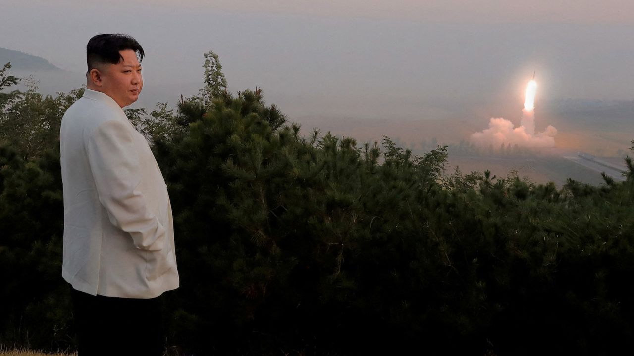 North Korea's leader Kim Jong Un oversees a missile launch at an undisclosed location, in a photo released on October 10 by North Korea's KCNA.