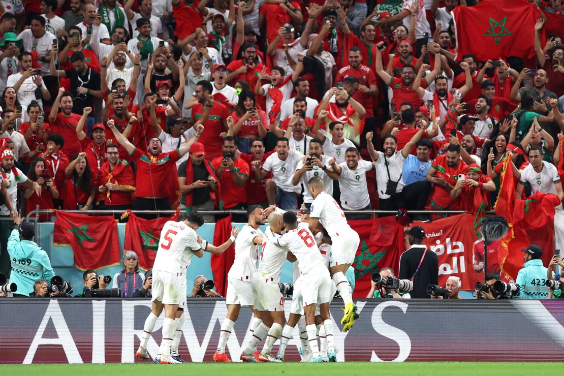 Morocco celebrates after scoring its  first goal against Belgium in its last match. 