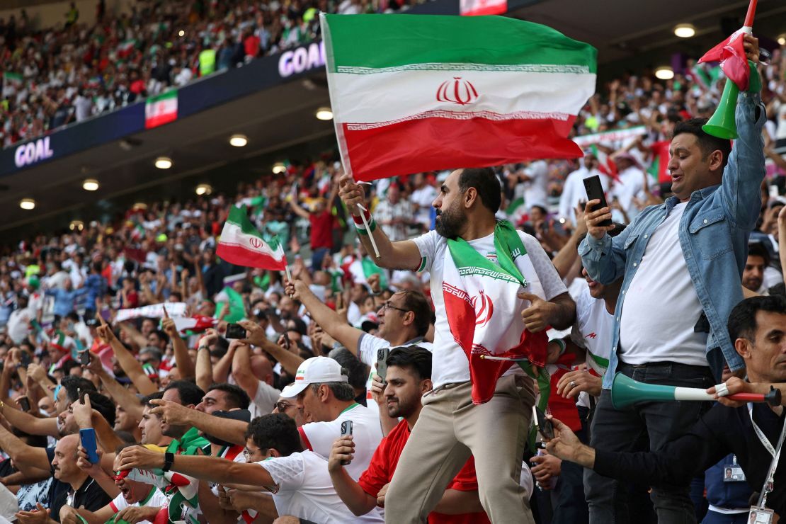 Iran's fans celebrate at the end of the Qatar 2022 World Cup Group B football match between Wales and Iran at the Ahmad Bin Ali Stadium in Al-Rayyan, west of Doha on November 25, 2022.
