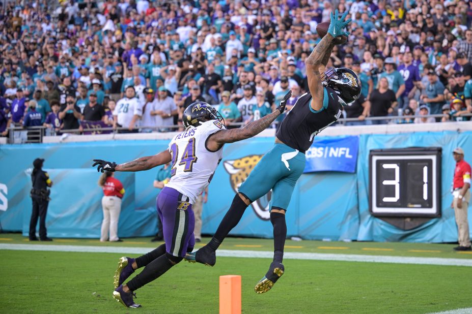 Jacksonville Jaguars wide receiver Marvin Jones Jr. makes the game-winning touchdown catch with 18 seconds left against Baltimore Ravens cornerback Marcus Peters during the second half of their game in Week 12.