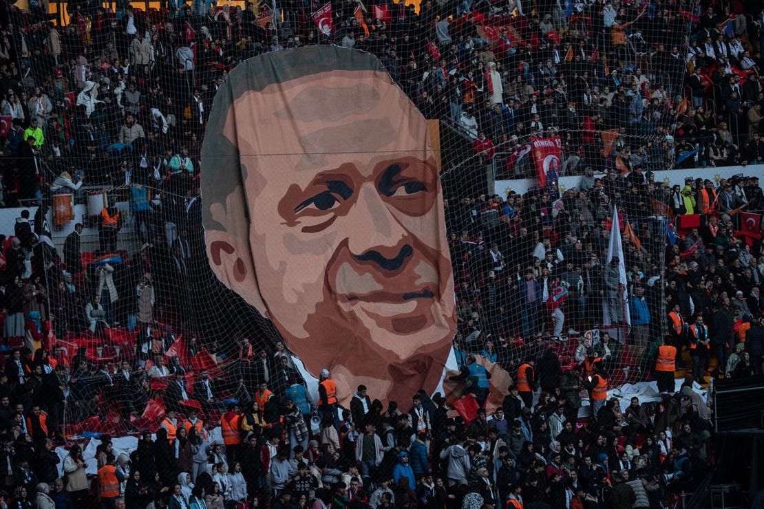 A giant poster of Turkey's President Recep Tayyip Erdogan is put on display at a stadium rally on Sunday in Istanbul. In next June's general election, the Turkish president is looking for another term in the office he has occupied since 2014.  