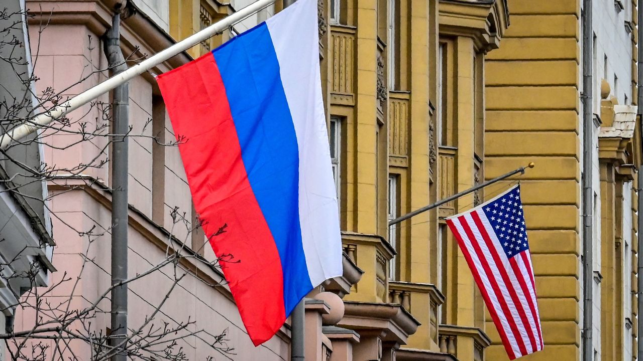 A Russian flag flies next to the US embassy building in Moscow on March 18, 2021.