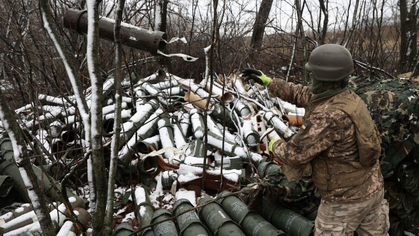 A Ukrainian artilleryman throws an empty 155MM shell tube as Ukrainian soldiers fire a M777 howitzer towards Russian positions on the frontline of eastern Ukraine, on November 23, 2022, amid the Russian invasion of Ukraine. (Photo by Anatolii Stepanov / AFP) (Photo by ANATOLII STEPANOV/AFP via Getty Images)