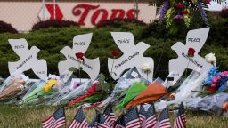 Flowers are left at a memorial at the scene of a weekend shooting at a Tops supermarket in Buffalo, New York, U.S. May 19, 2022.  REUTERS/Brendan McDermid 