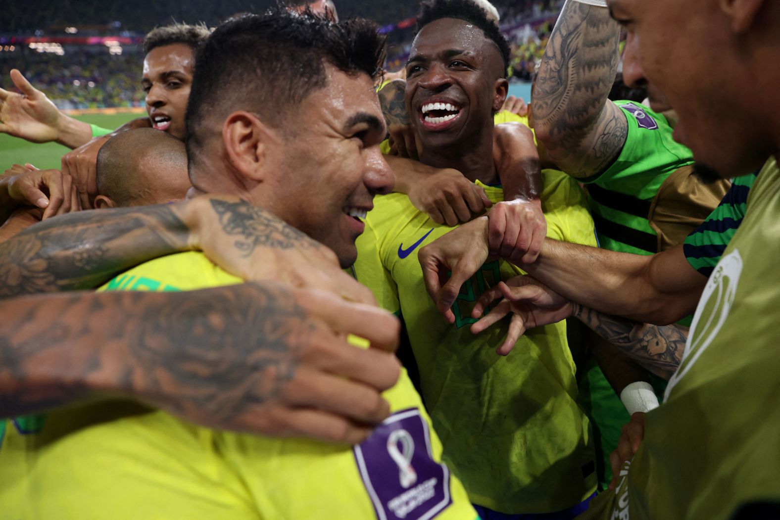 Brazilian midfielder Casemiro, front left, is mobbed by teammates after scoring against Switzerland.