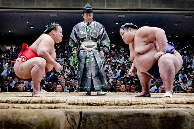 Wrestlers face off ahead of a professional bout.