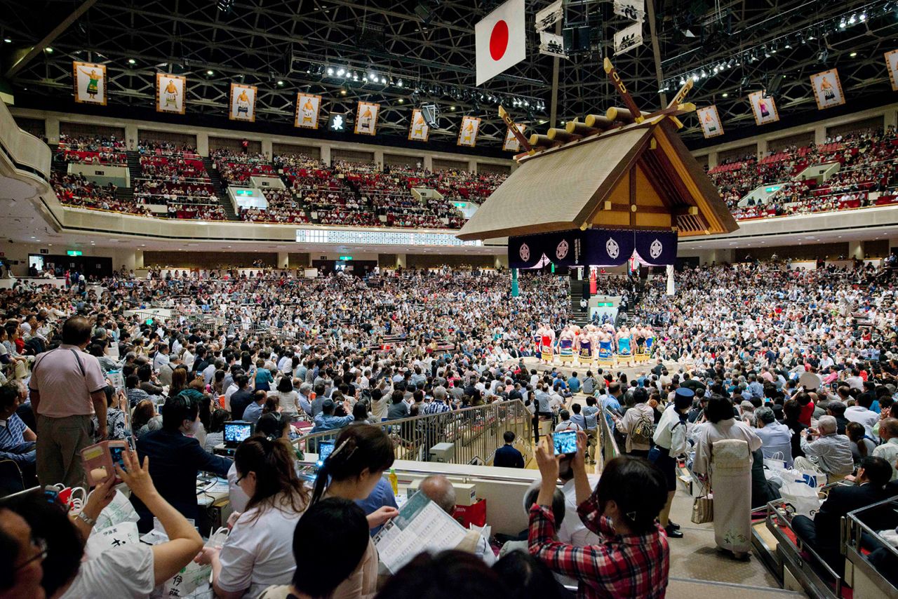 Fans fill one of Tokyo's prestigious sumo venues, the Kokugikan Arena.