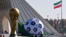 Sculptures of the FIFA World Cup trophy and a soccer ball are placed next to the Azadi (Freedom) monument in the west of Tehran, November 18, 2022. 