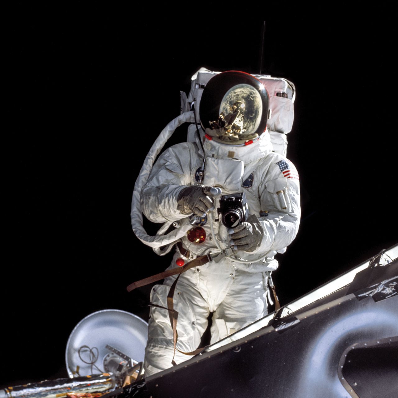 With the Earth reflected in his visor, Lunar Module Pilot Russell Schweickart takes a photo during his Extravehicular Activity on Apollo 9 in March 1969. 
