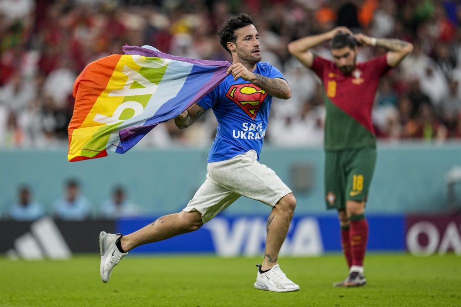 A man <a href="https://www.cnn.com/2022/11/28/football/pitch-invader-rainbow-flag-2022-world-cup-spt-intl/index.html" target="_blank">runs onto the field with a rainbow flag</a> during the match between Portugal and Uruguay. The man, an Italian named Mario Ferri, was also wearing a shirt that said "save Ukraine" on the front and "respect for Iranian women" on the back. In a series of posts of his Instagram story, Ferri called himself the "new Robin Hood" and said, "Breaking the rules if you do it for a good cause is NEVER A CRIME." He was banned from attending future matches.