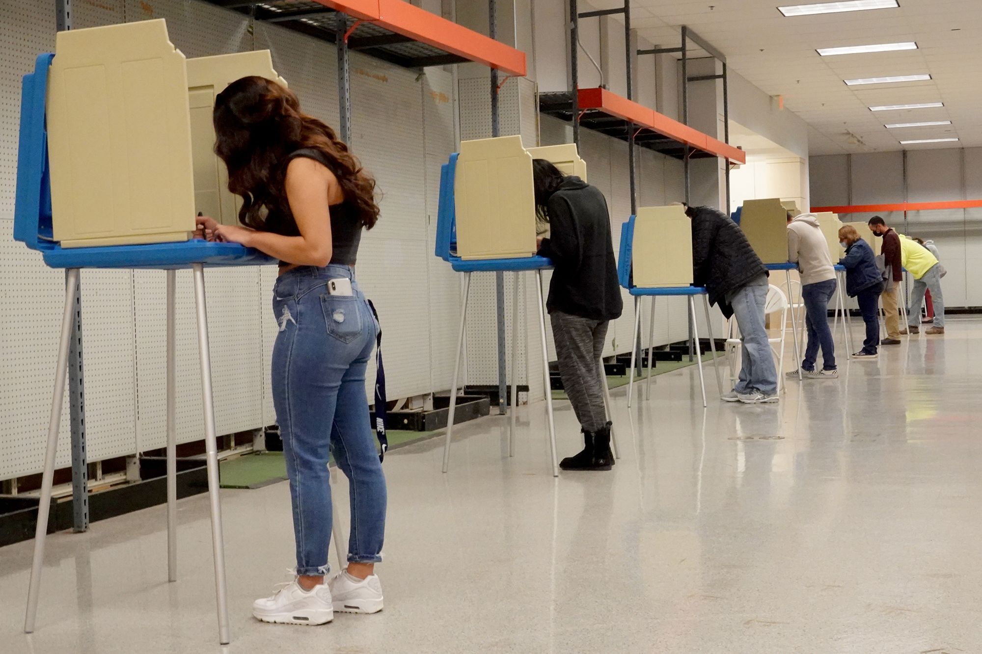 Residents cast their vote in the 2020 presidential election at a shuttered Sears store in Janesville, Wisconsin.