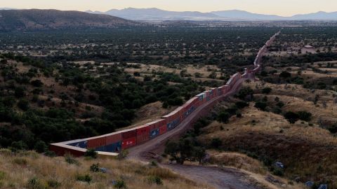 A view of shipping containers from the border wall on the frontier with Mexico in Cochise County, Arizona on November 6, 2022.  