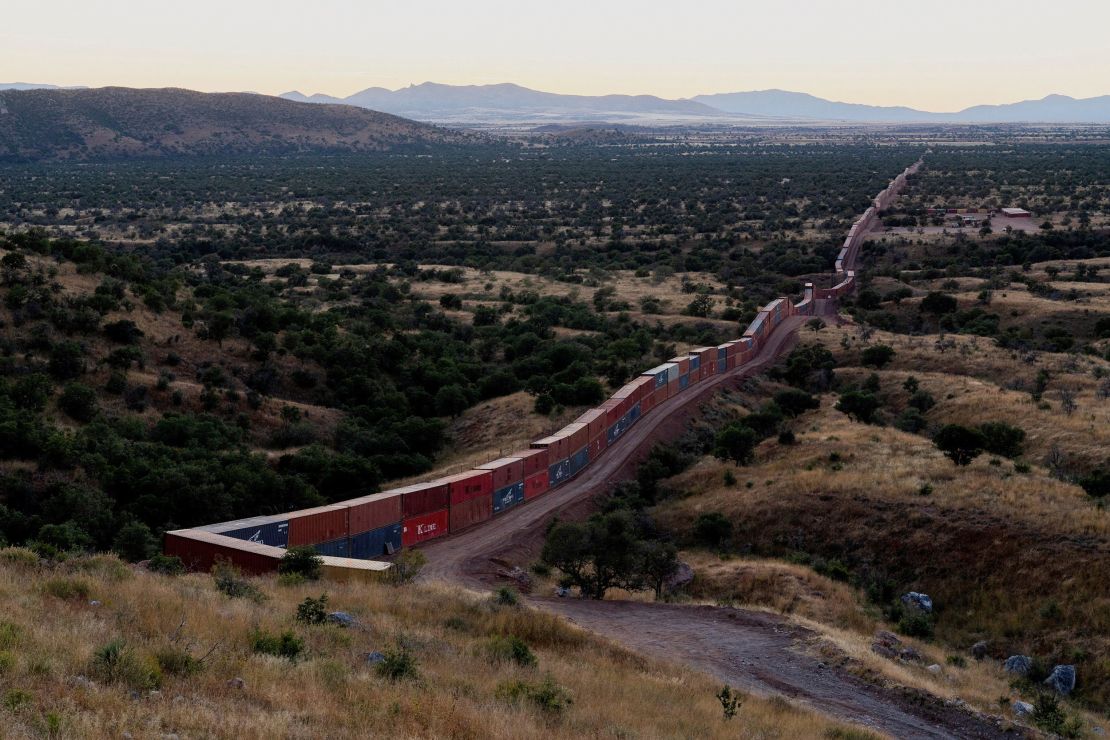 A view of shipping containers from the border wall on the frontier with Mexico in Cochise County, Arizona on November 6, 2022.  