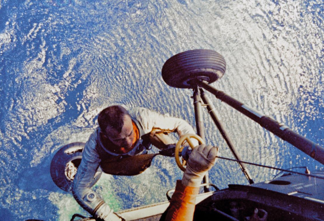 Shepard is lifted up to the helicopter after he splashed down in the Atlantic Ocean aboard the Mercury capsule in May 1961.