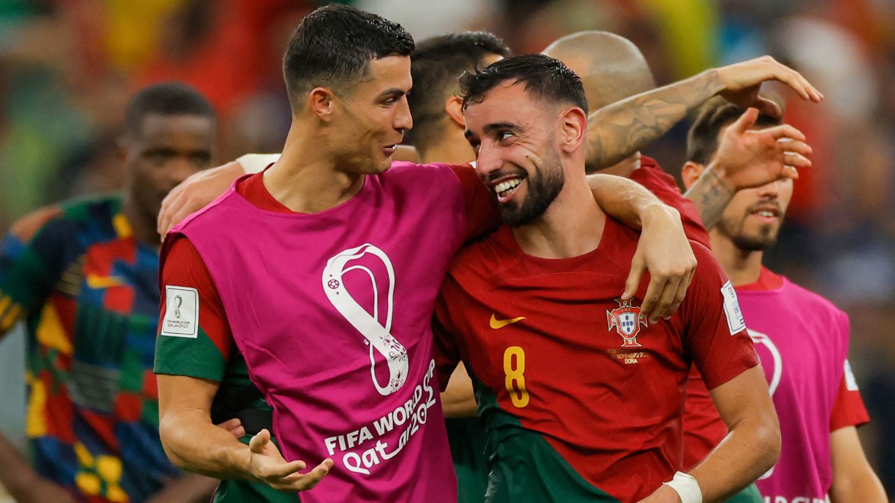 Cristiano Ronaldo and Bruno Fernandes celebrate after Portugal beat Uruguay at 2022 World Cup. 