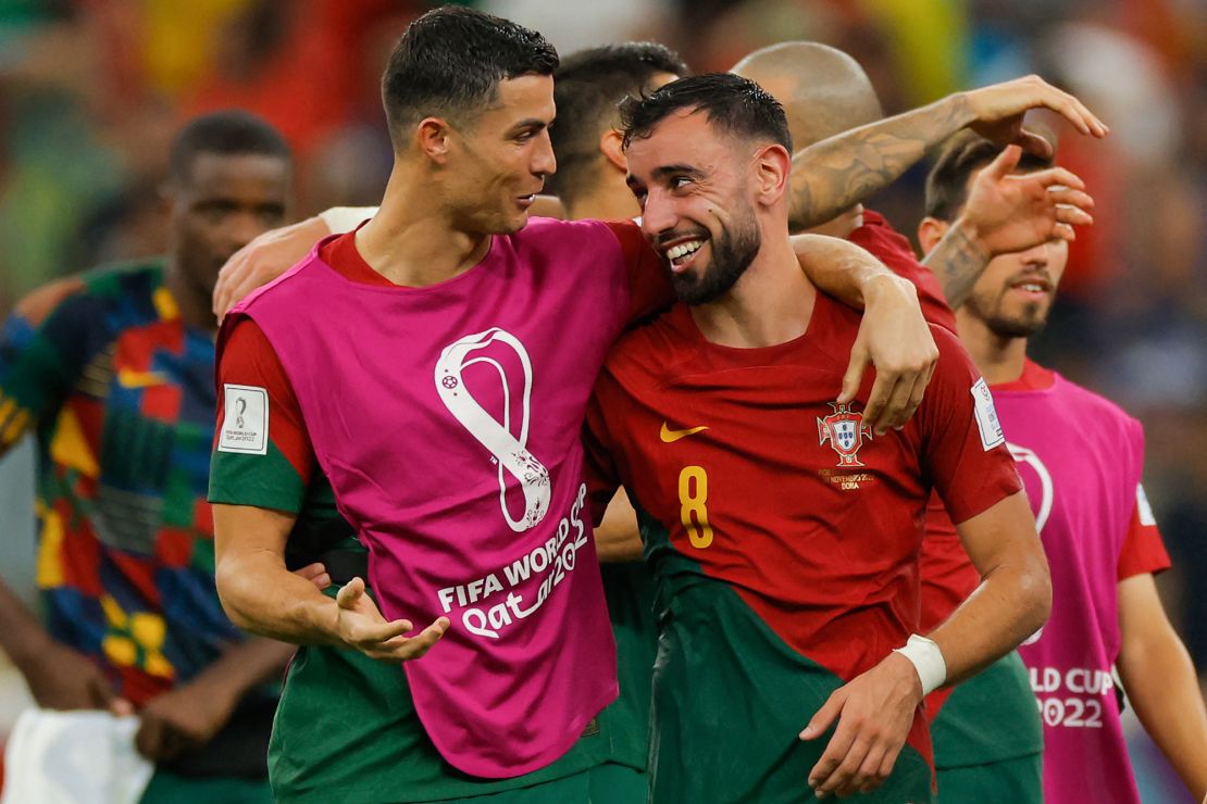 Cristiano Ronaldo and Bruno Fernandes celebrate after Portugal beat Uruguay at 2022 World Cup. 