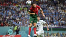 LUSAIL CITY, QATAR - NOVEMBER 28: Cristiano Ronaldo of Portugal attempts to head the ball as Bruno Fernandes (not pictured) scores their team's first goal during the FIFA World Cup Qatar 2022 Group H match between Portugal and Uruguay at Lusail Stadium on November 28, 2022 in Lusail City, Qatar. (Photo by Justin Setterfield/Getty Images)