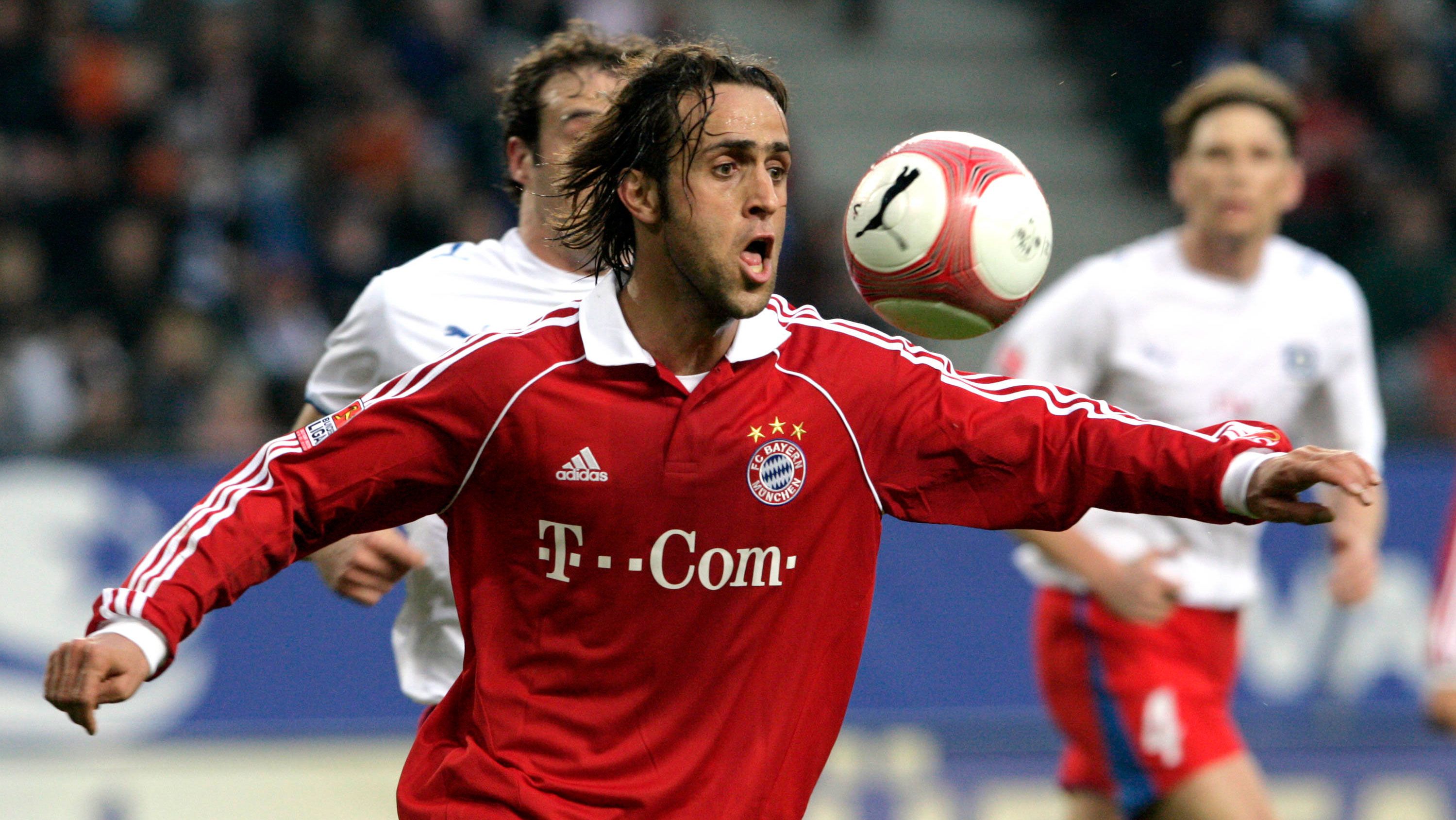  Ali Karimi, playing for Bayern Munich, fixes the ball during a friendly match between Hamburger SV and Bayern on January 20, 2007. 