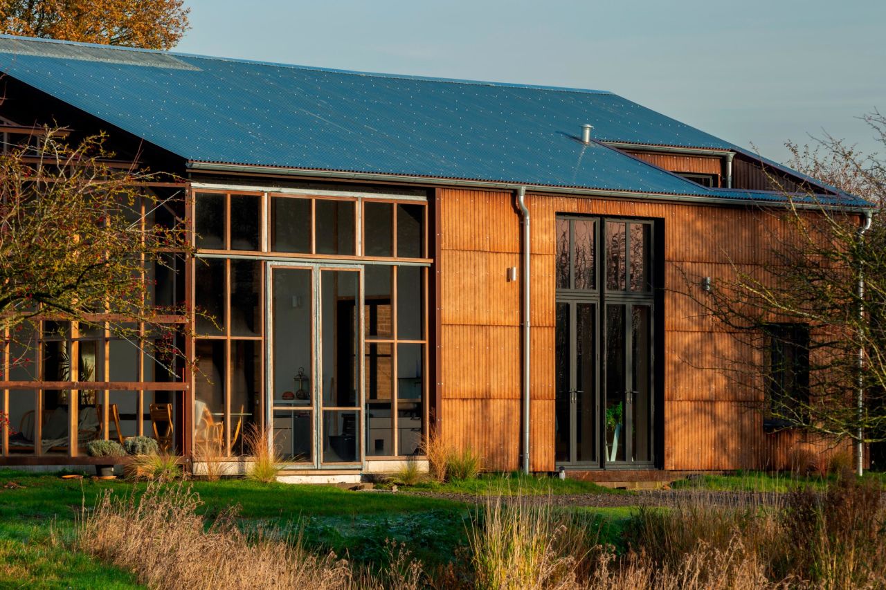 <strong>Flat House, Cambridgeshire, UK, Practice Architecture (2019) -- </strong>The client for this English project makes hemp-based products, and wanted to build using hemp grown on site. Hemp was processed into prefabricated hempcrete blocks, which don't have structural properties, says Topham, but are good at heat insulation and moisture control. The blocks were slotted into a timber frame and the building covered with cladding made from hemp fiber and a sugar-based resin. Hempcrete is biodegradable, so in theory, "once (it's) finished with it can be dismantled, and the material used can be put back into the land," says Topham.