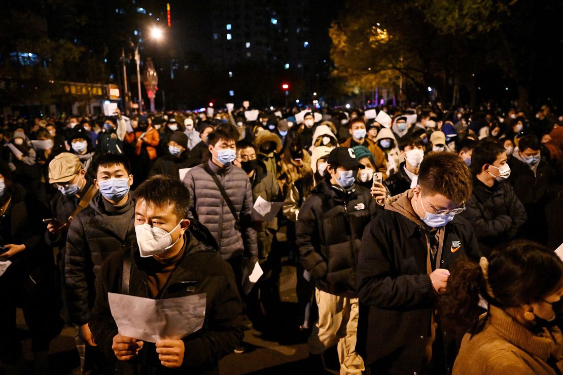 Protesters shout slogans against China's strict zero-Covid measures on November 28, 2022 in Beijing.