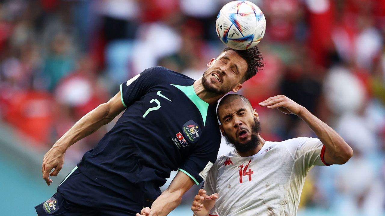 Mathew Leckie of Australia competes for a header against Aissa Laidouni of Tunisia during Group D match between Tunisia and Australia.