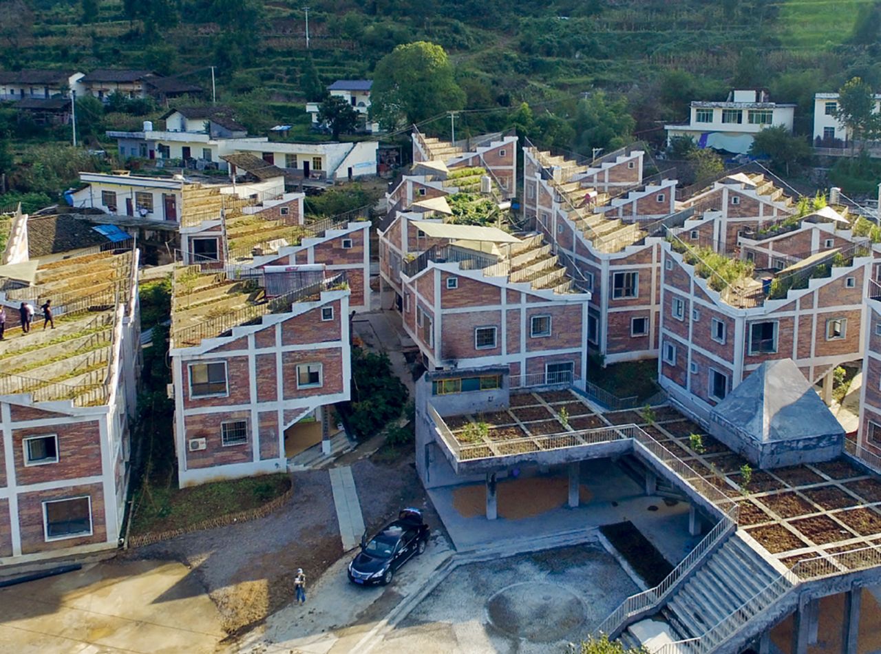 <strong>Jintai Village Reconstruction, Bazhong, China, Rural Urban Framework (2017) -- </strong>Homes in the village had been destroyed by an earthquake in 2008 and then a landslide in 2011. Rural Urban Framework collaborated with the government and non-profits on a replacement 22-house community with many elements to promote self-sufficiency, including garden roofs, water collection, a biogas generator and reedbed waste treatment system. The ground floor level is entirely communal. "All of these homes move away from the idea of consumption to circular architecture," says Smith. "They're a good example of how you can go back to an understanding of yourself and your community as an autonomous system."
