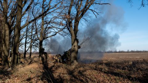 Ukrainian forces fire an artillery piece at Russian positions at the frontline near Bakhmut, in eastern Ukraine.