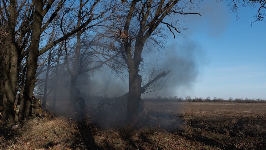 Ukrainian forces fire an artillery piece at Russian positions at the frontline near Bakhmut, in eastern Ukraine.