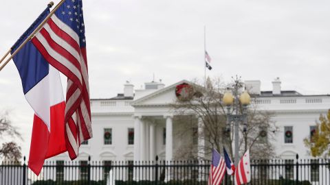 A French flag flies alongside the US flag in front of the White House in preparation for this week's state visit by French President Emmanuel Macron, in Washington, U.S., November 29, 2022. 
