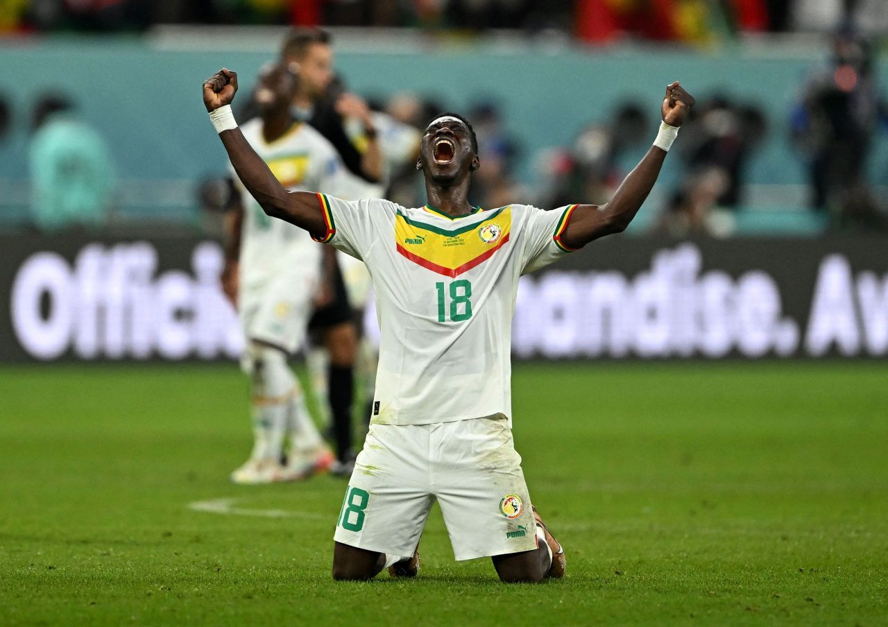 Senegal's Ismaila Sarr celebrates Tuesday after a 2-1 win over Ecuador secured his team's spot in the next round of the World Cup.