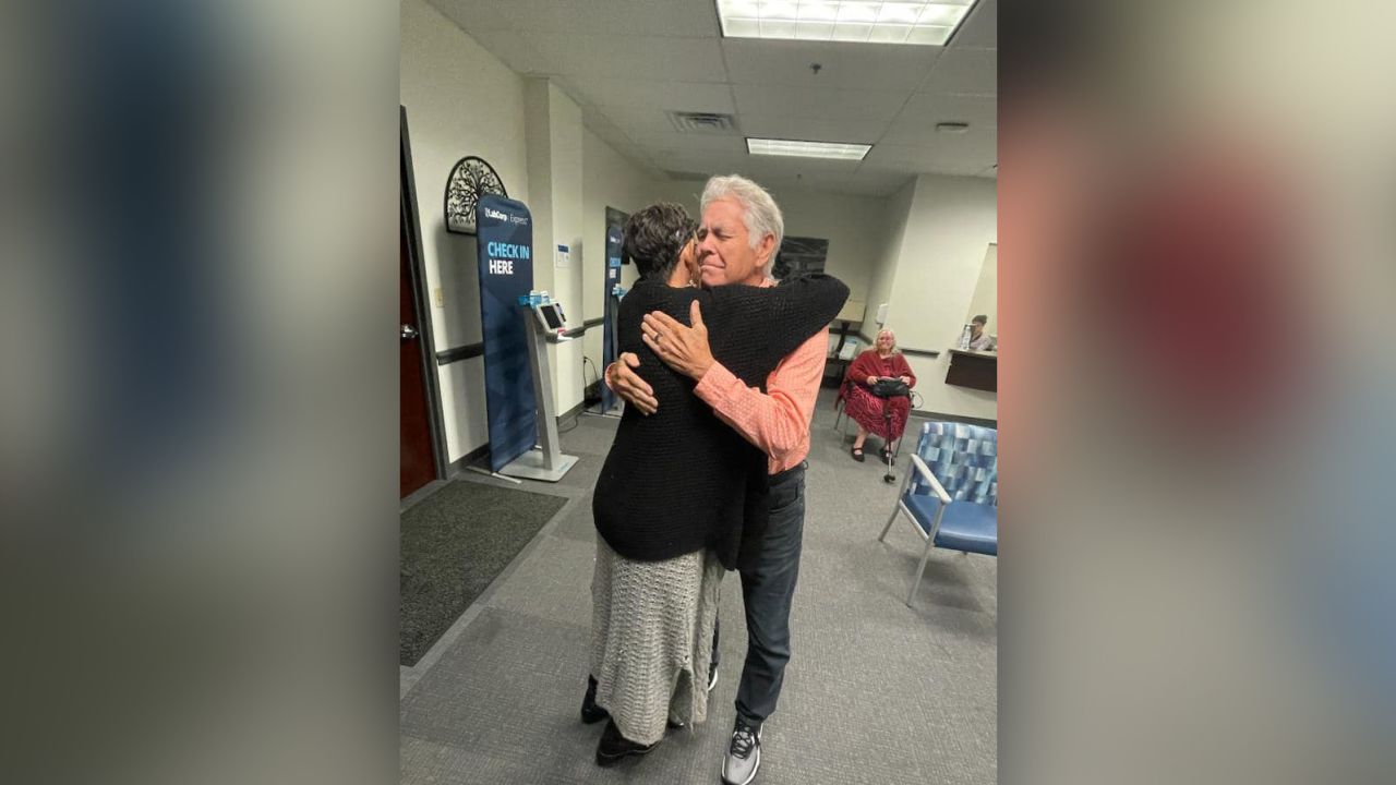Highsmith hugs her father while being reunited after decades of separation. 