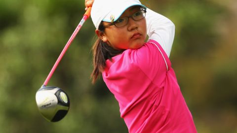 A 12-year-old Ko tees off at the New Zealand Men's & Women's Amateur Championship in April 2009.