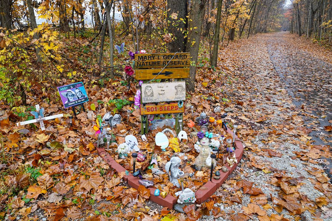 A makeshift memorial to the teen girls near where they were last seen and where the bodies were discovered stands along the Monon Trail leading to the Monon High Bridge Trail in Delphi, Indiana, on October 31, 2022. 