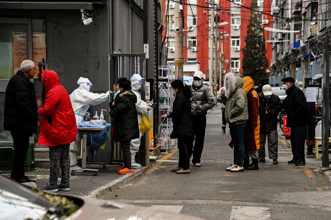 Residents line up for Covid-19 testing at a residential complex in Hohhot, Inner Mongolia, China on December 1, 2022.