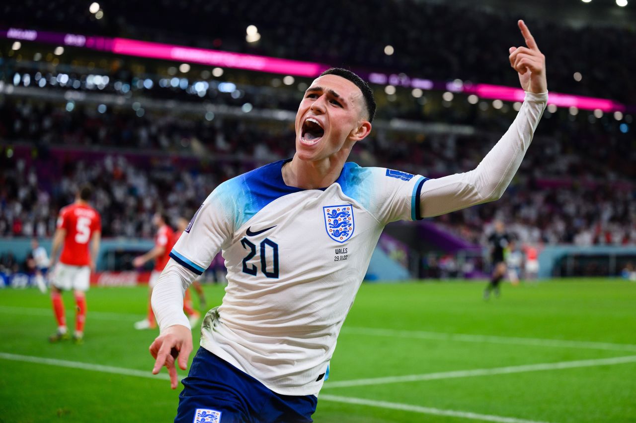 England's Phil Foden celebrates after scoring his team's second goal in the 3-0 win over Wales on Tuesday. England won Group B.