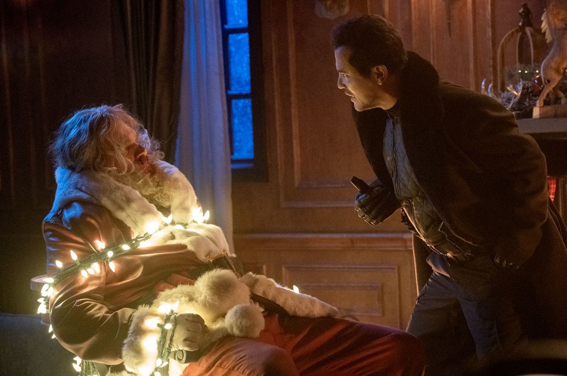 (from left) Santa (David Harbour) and Scrooge (John Leguizamo) in Violent Night, directed by Tommy Wirkola.