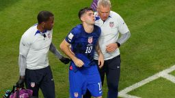 Christian Pulisic of the United States is helped by team doctors after he scoring his side's opening goal during the World Cup group B soccer match between Iran and the United States at the Al Thumama Stadium in Doha, Qatar, Tuesday, Nov. 29, 2022. (AP Photo/Luca Bruno)