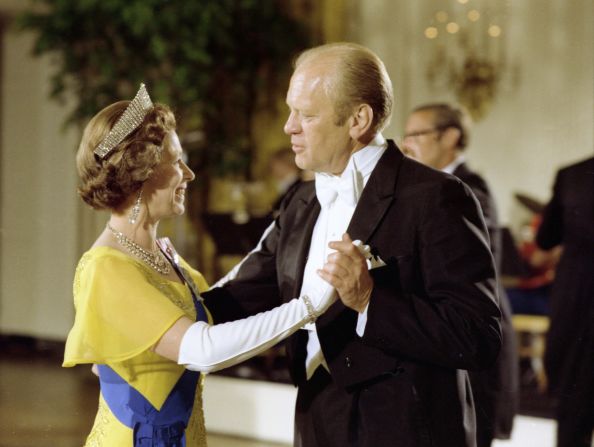 US President Gerald Ford dances with Britain's Queen Elizabeth II during a state dinner in Washington, DC, in 1976.