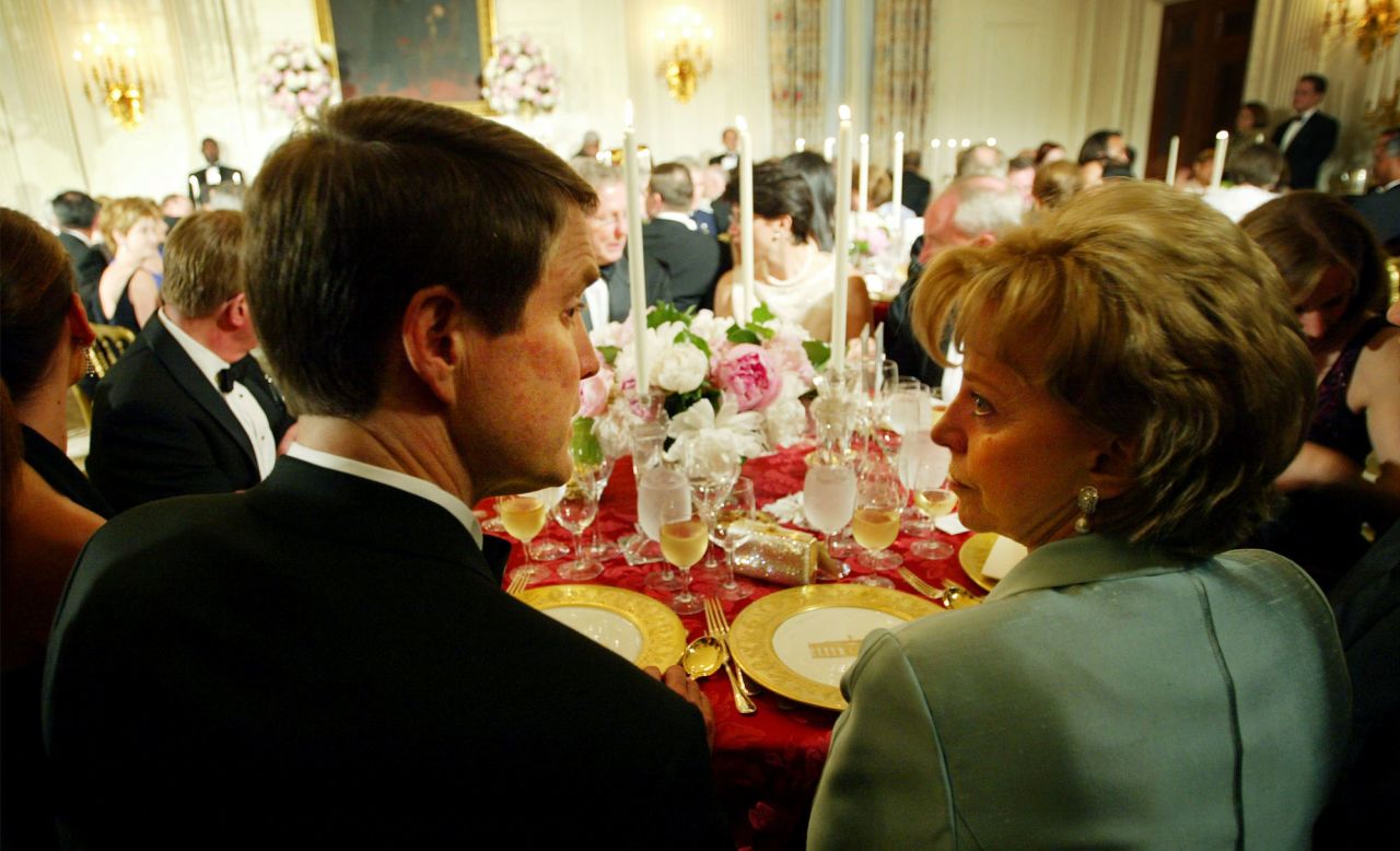Senate Majority Leader Bill Frist and Lynne Cheney, wife of Vice President Dick Cheney, take their seats in 2003 for a state dinner held in honor of Philippine President Gloria Macapagal Arroyo.